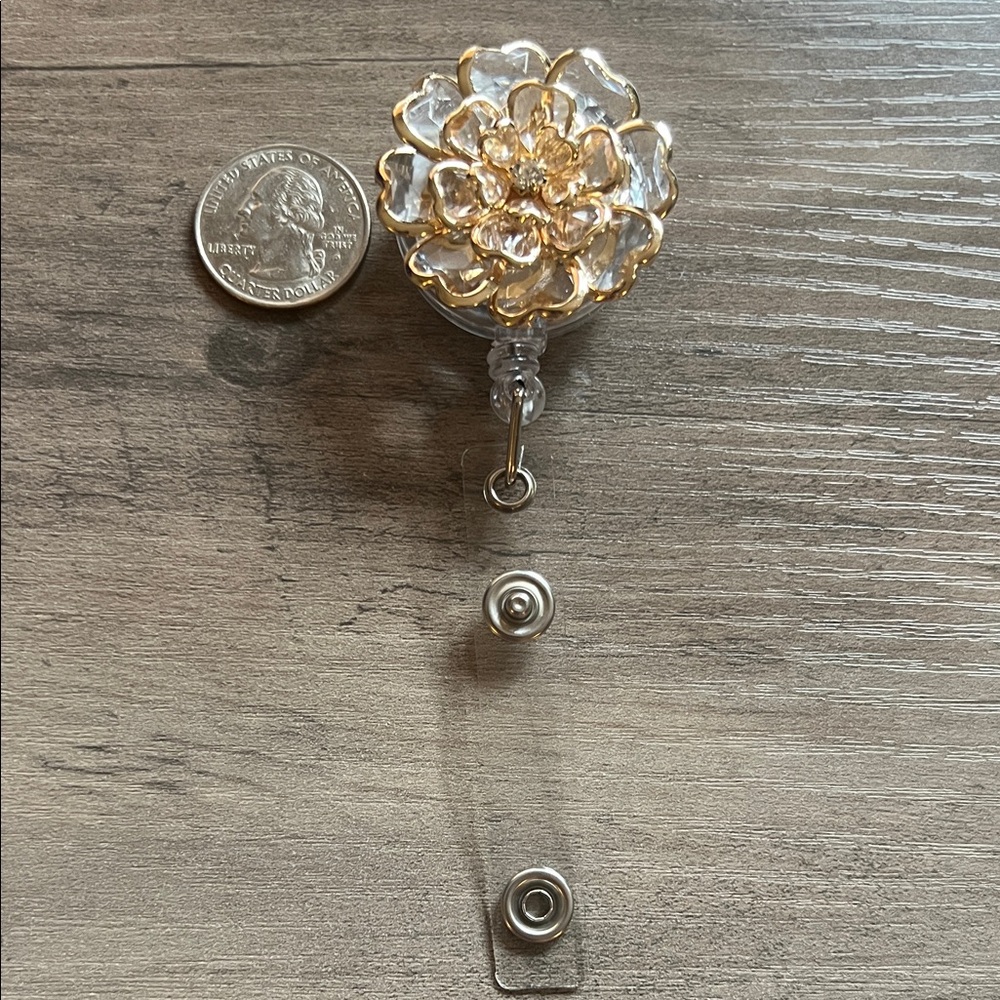 Gold flower badge reel shaped